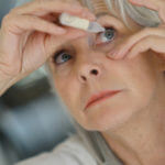 older lady applying eye drops