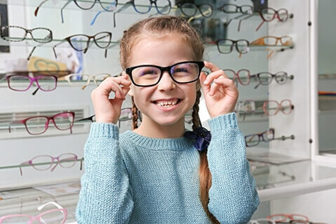 Girl trying on glasses